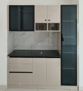 White modular crockery unit with glass shutters and black granite countertop by SB Interior Solutions Hyderabad