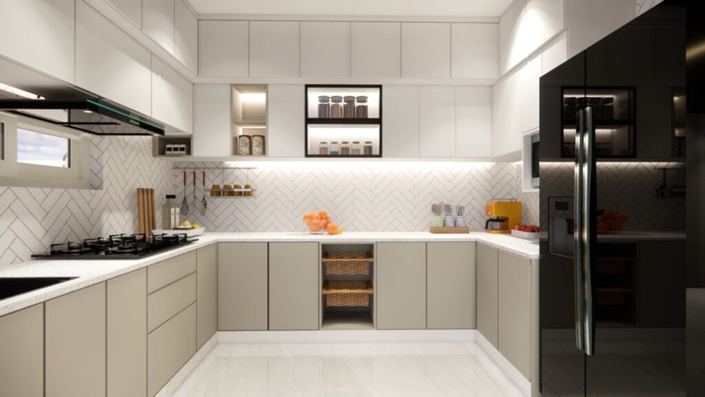 U-shaped modular kitchen with beige cabinets and herringbone tile backsplash by SB Interior Solutions Hyderabad